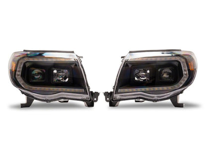 Raxiom 05-11 Toyota Tacoma Axial Series Switchback Projector Headlights- Black Housing- Clear Lens