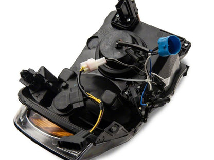 Raxiom 02-05 Dodge RAM 1500/2500/3500 Axial LED Projector Headlights- Black Housing (Clear Lens)