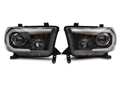 Raxiom 07-13 Toyota Tundra Axial Projector Headlights w/ SEQL LED Bar- Black Housing (Clear Lens)