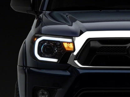 Raxiom 12-15 Toyota Tacoma Axial Series Projector Headlights w/ LED Bar- Black Housing (Clear Lens)