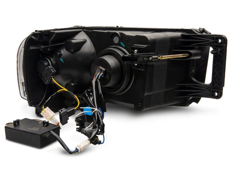Raxiom 02-05 Dodge RAM 1500 LED Projector Headlights w/ SEQL LED Bar- Black Housing (Clear Lens)