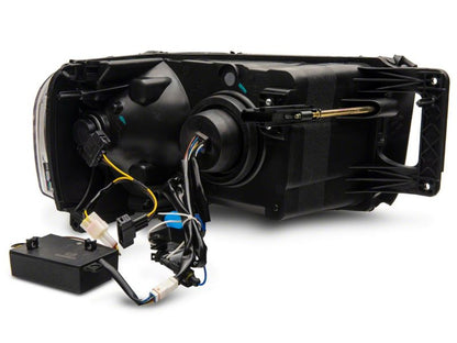 Raxiom 02-05 Dodge RAM 1500 LED Projector Headlights w/ SEQL LED Bar- Black Housing (Clear Lens)