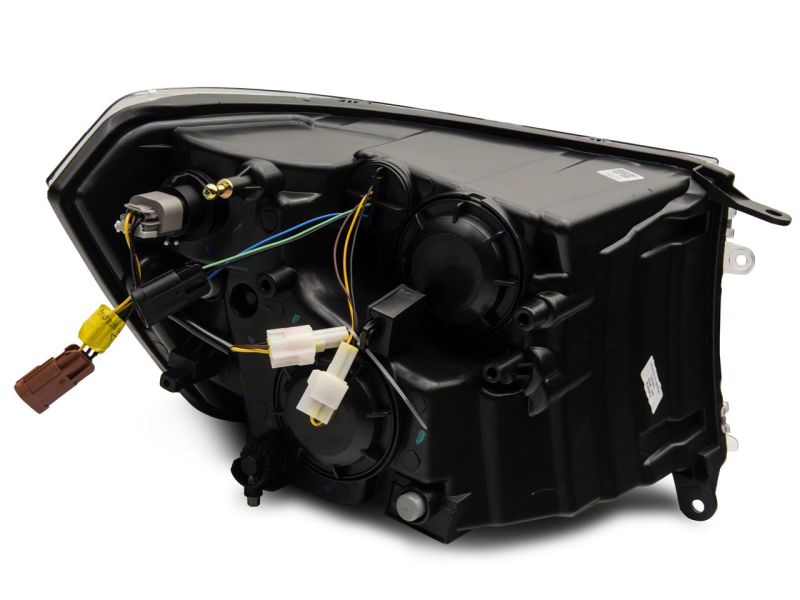 Raxiom 09-18 Dodge RAM 1500/2500/3500 Axial Headlights w/ SEQL LED Bar- Black Housing (Clear Lens)