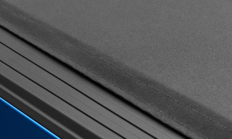 Lund 09-14 Ford F-150 (5.5ft. Bed) Genesis Elite Roll Up Tonneau Cover - Black