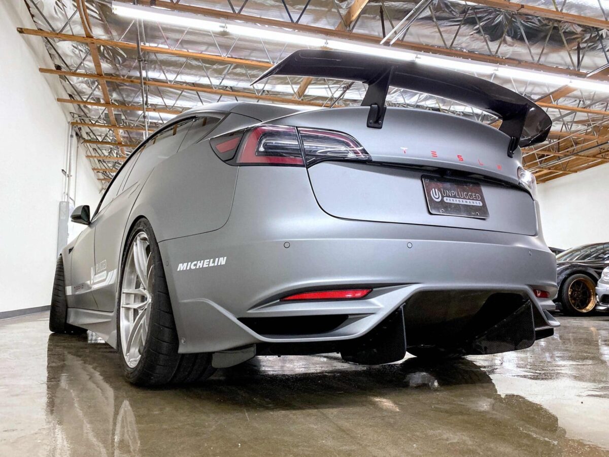 UNPLUGGED PERFORMANCE UP-M3-304-4.1 ASCENSION REAR BUMPER - OPTIONAL ASCENSION-R REAR DIFFUSER FINS, DRY CARBON GLOSS CLEAR FOR TESLA MODEL 3
