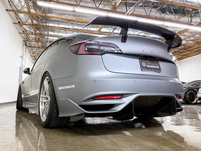 UNPLUGGED PERFORMANCE UP-M3-304-4.1 ASCENSION REAR BUMPER - OPTIONAL ASCENSION-R REAR DIFFUSER FINS, DRY CARBON GLOSS CLEAR FOR TESLA MODEL 3