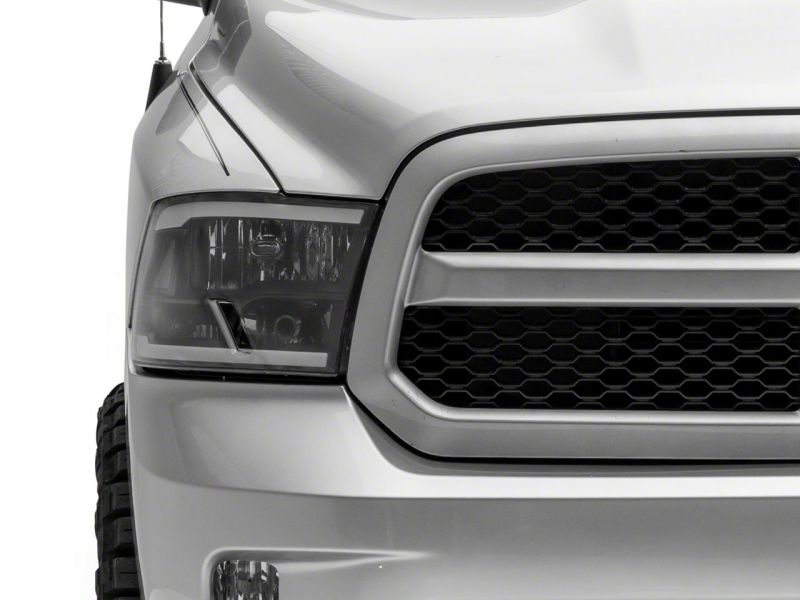Raxiom 09-18 Dodge RAM 1500/2500/3500 Axial Series Headlights w/ LED Bar- Black Housing (Clear Lens)