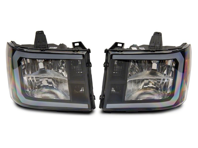 Raxiom 07-13 GMC Sierra 1500 Axial Series Headlights w/ LED Bar- Black Housing (Clear Lens)