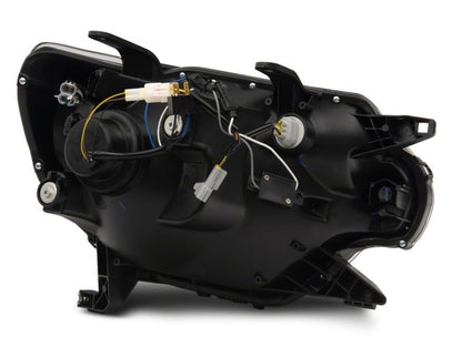Raxiom 12-15 Toyota Tacoma Axial Projector Headlights w/ SEQL LED Bar- Black Housing (Clear Lens)