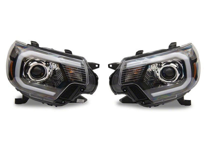 Raxiom 12-15 Toyota Tacoma Axial Projector Headlights w/ SEQL LED Bar- Black Housing (Clear Lens)