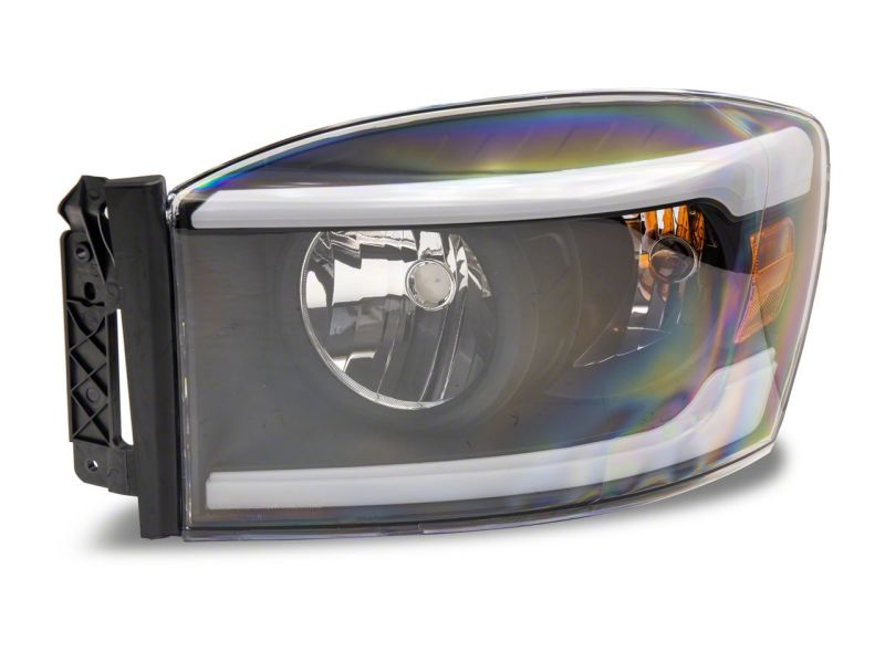 Raxiom 06-09 Dodge RAM 1500/2500/3500 Axial Headlights w/ SEQL LED Bar- Black Housing (Clear Lens)