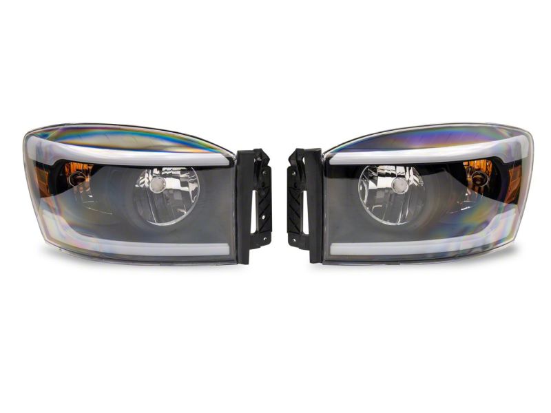 Raxiom 06-09 Dodge RAM 1500/2500/3500 Axial Headlights w/ SEQL LED Bar- Black Housing (Clear Lens)