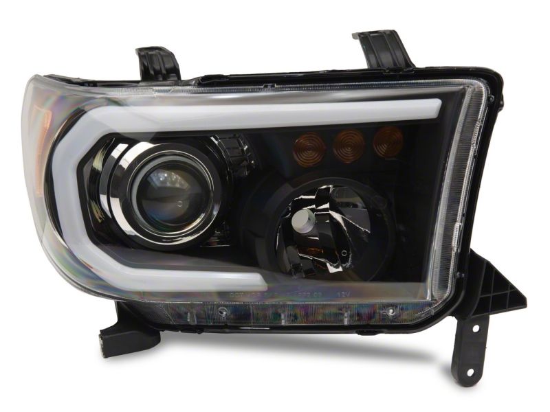 Raxiom 07-13 Toyota Tundra Axial Projector Headlights w/ SEQL LED Bar- Black Housing (Clear Lens)