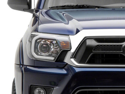 Raxiom 12-15 Toyota Tacoma Axial Series Projector Headlights w/ LED Bar- Black Housing (Clear Lens)