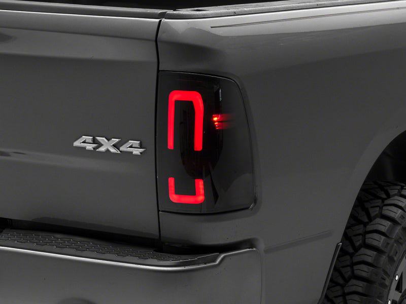 Raxiom 09-18 Dodge RAM 1500/2500/3500 Axial Series LED Tail Lights- Black Housing (Smoked Lens)