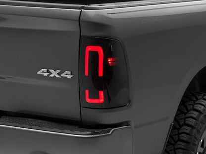 Raxiom 09-18 Dodge RAM 1500/2500/3500 Axial Series LED Tail Lights- Black Housing (Smoked Lens)