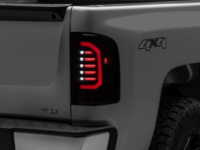 Raxiom 07-14 Chevrolet Silverado 1500 Axial Series LED Tail Lights- Black Housing (Smoked Lens)