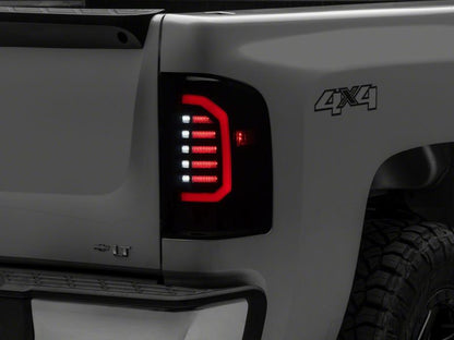 Raxiom 07-14 Chevrolet Silverado 1500 Axial Series LED Tail Lights- Black Housing (Smoked Lens)