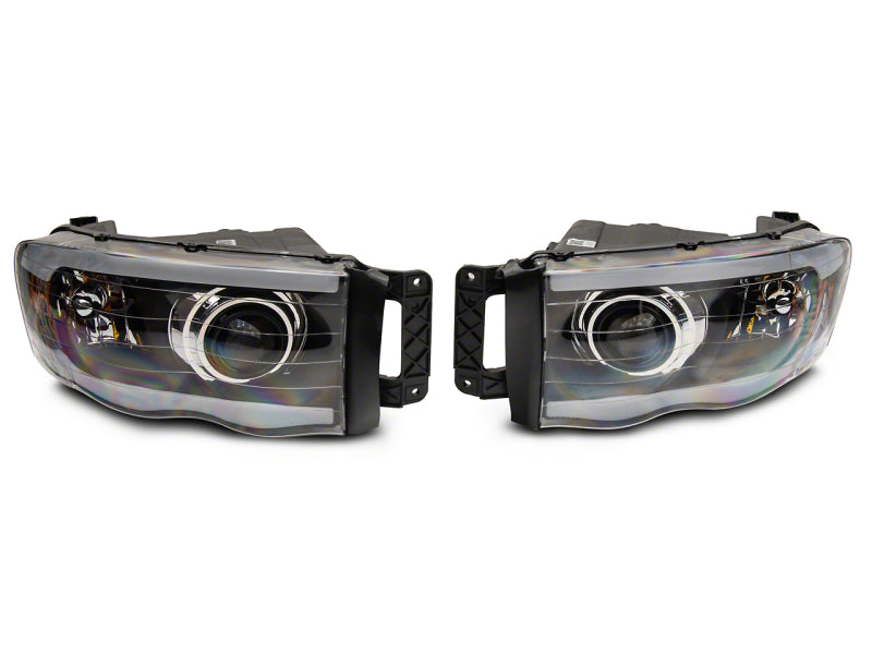 Raxiom 02-05 Dodge RAM 1500/2500/3500 Axial LED Projector Headlights- Black Housing (Clear Lens)