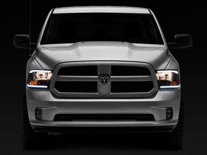 Raxiom 09-18 Dodge RAM 1500/2500/3500 Axial Series Headlights w/ LED Bar- Black Housing (Clear Lens)