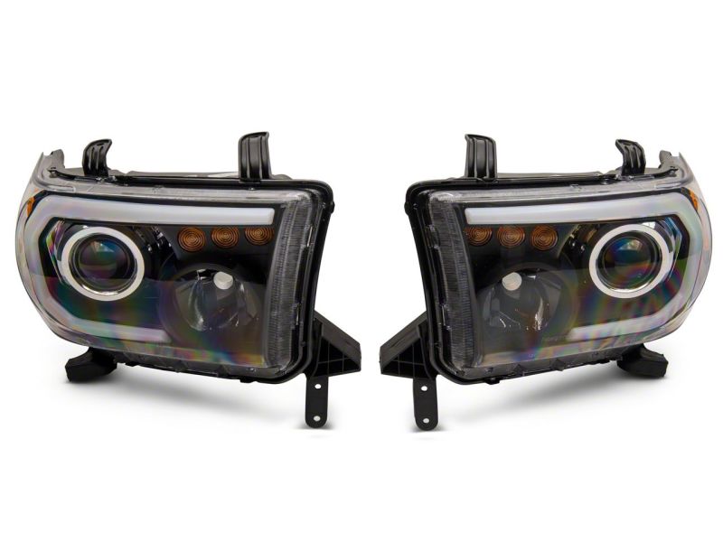 Raxiom 07-13 Toyota Tundra Axial Series Projector Headlights w/ LED Bar- Black Housing (Clear Lens)