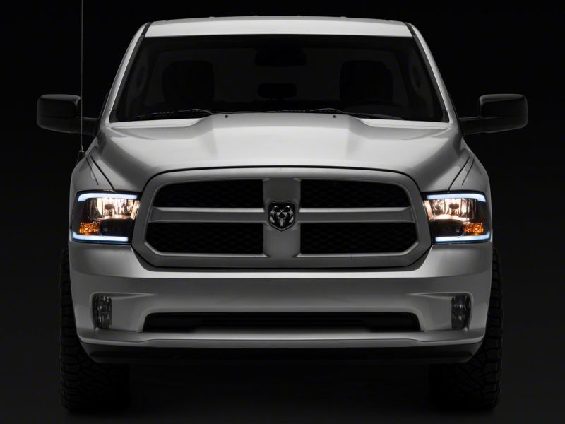 Raxiom 09-18 Dodge RAM 1500/2500/3500 Axial Headlights w/ SEQL LED Bar- Black Housing (Clear Lens)