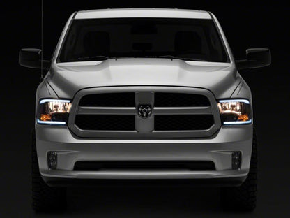 Raxiom 09-18 Dodge RAM 1500/2500/3500 Axial Headlights w/ SEQL LED Bar- Black Housing (Clear Lens)