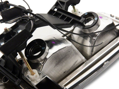 Raxiom 99-06 GMC Sierra 1500 Axial Series Headlights w/ LED Bar- Black Housing (Clear Lens)