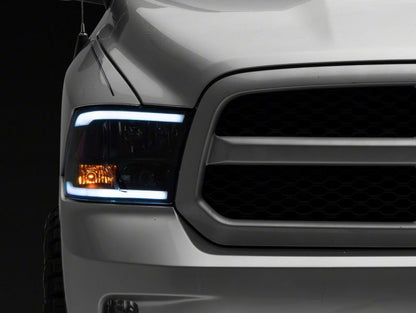 Raxiom 09-18 Dodge RAM 1500/2500/3500 Axial Headlights w/ SEQL LED Bar- Black Housing (Clear Lens)