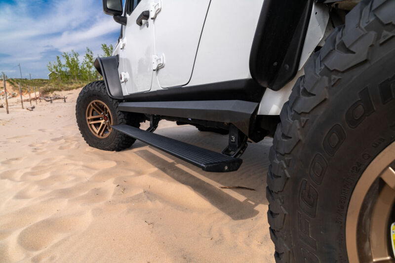 AMP Research 2007-2018 Jeep Wrangler JKU 4DR PowerStep XL - Black (Incl OEM Style Illumination)