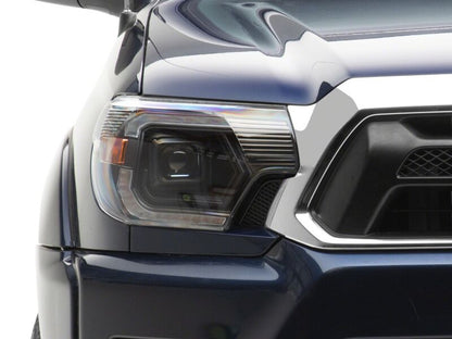 Raxiom 12-15 Toyota Tacoma Axial Series Switchback Projector Headlights- Black Housing- Clear Lens