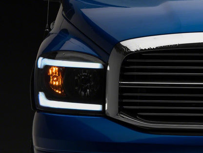 Raxiom 06-09 Dodge RAM 1500/2500/3500 Axial Headlights w/ SEQL LED Bar- Black Housing (Clear Lens)