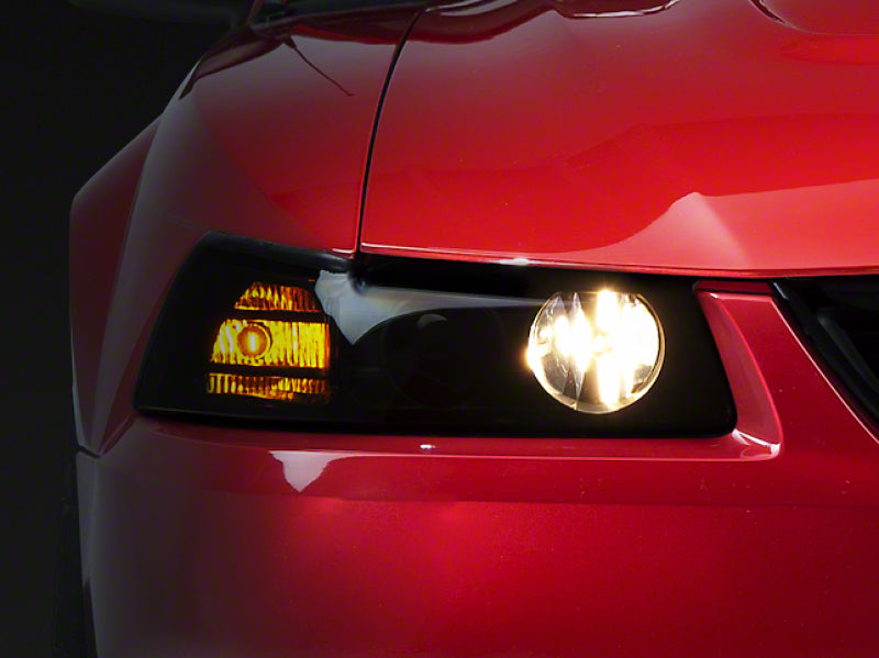 Raxiom 99-04 Ford Mustang Axial Series Projector Headlights- Black Housing (Smoked Lens)