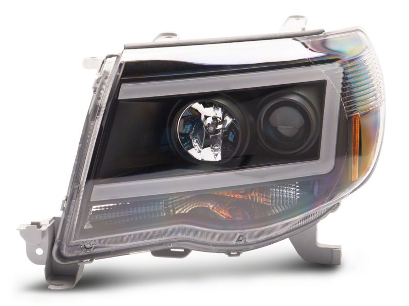 Raxiom 05-11 Toyota Tacoma Axial Series LED DRL Projector Headlights- Black Housing (Clear Lens)