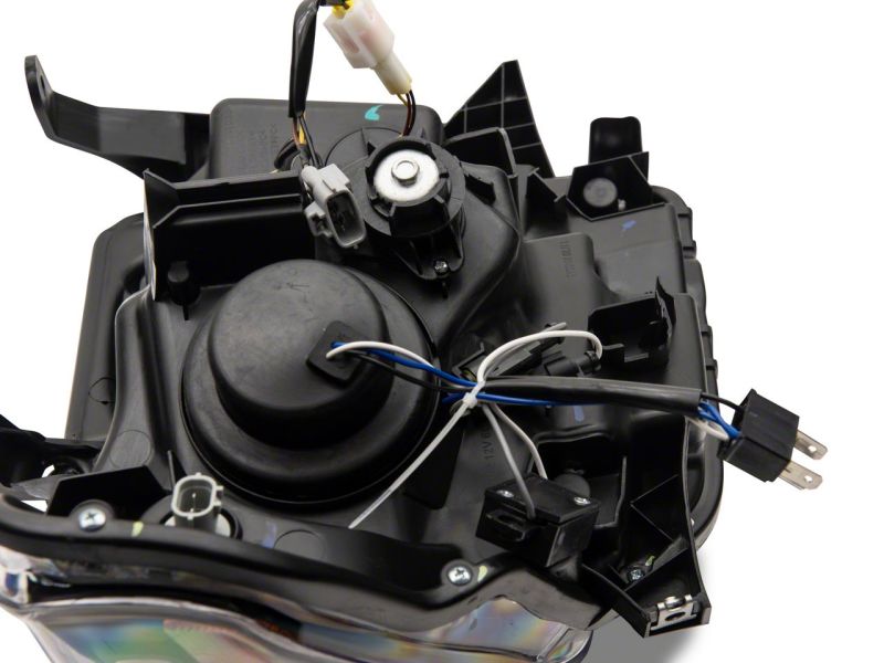 Raxiom 14-21 Toyota Tundra Axial Projector Headlights w/ SEQL LED Bar- Black Housing (Clear Lens)