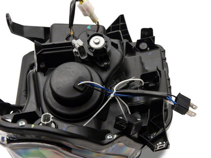 Raxiom 14-21 Toyota Tundra Axial Projector Headlights w/ SEQL LED Bar- Black Housing (Clear Lens)