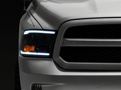 Raxiom 09-18 Dodge RAM 1500/2500/3500 Axial Series Headlights w/ LED Bar- Black Housing (Clear Lens)