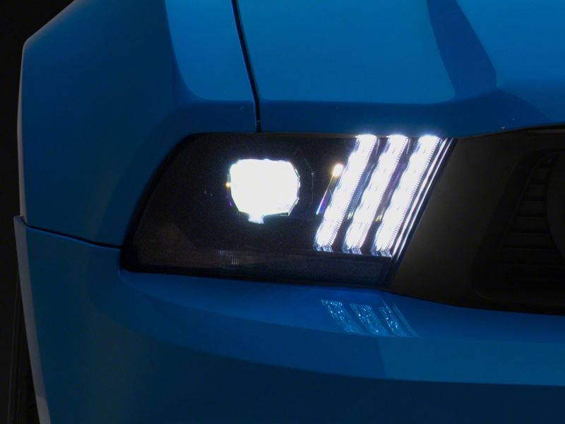 Raxiom 10-12 Ford Mustang LED Projector Headlights SEQL Turn Signals- Black Housing (Clear Lens)