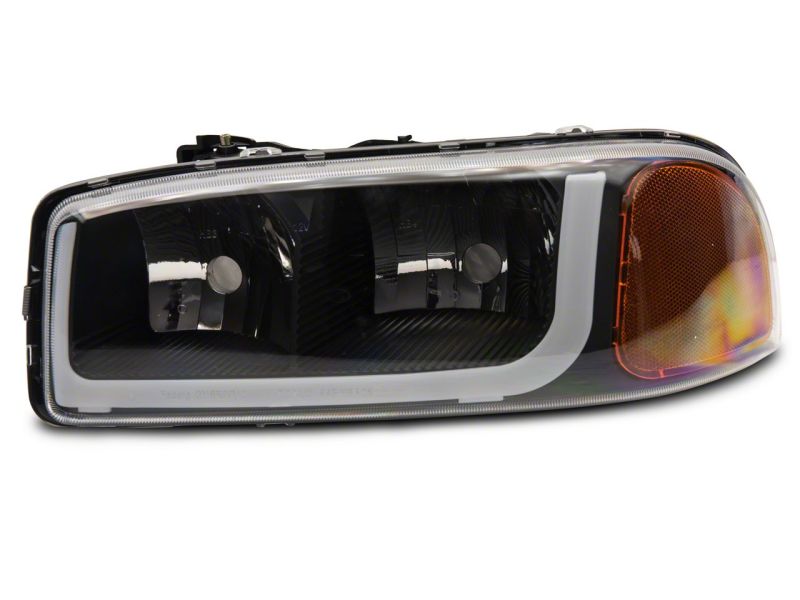 Raxiom 99-06 GMC Sierra 1500 Axial Series Headlights w/ LED Bar- Black Housing (Clear Lens)