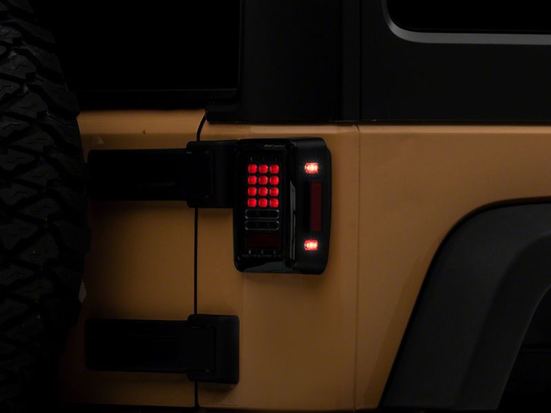Raxiom 07-18 Jeep Wrangler JK Axial Series LED Tail Lights- Black Housing (Clear Lens)